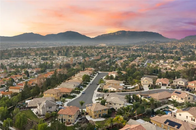 an aerial view of residential houses and city street
