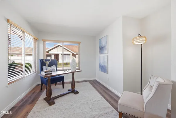 a work room with furniture and a window