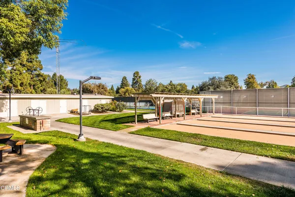 an aerial view of multiple houses with yard