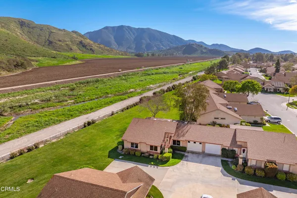 an aerial view of a house with mountain view