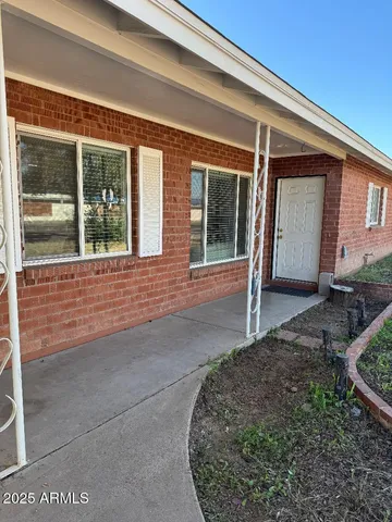 a view of a house with a porch