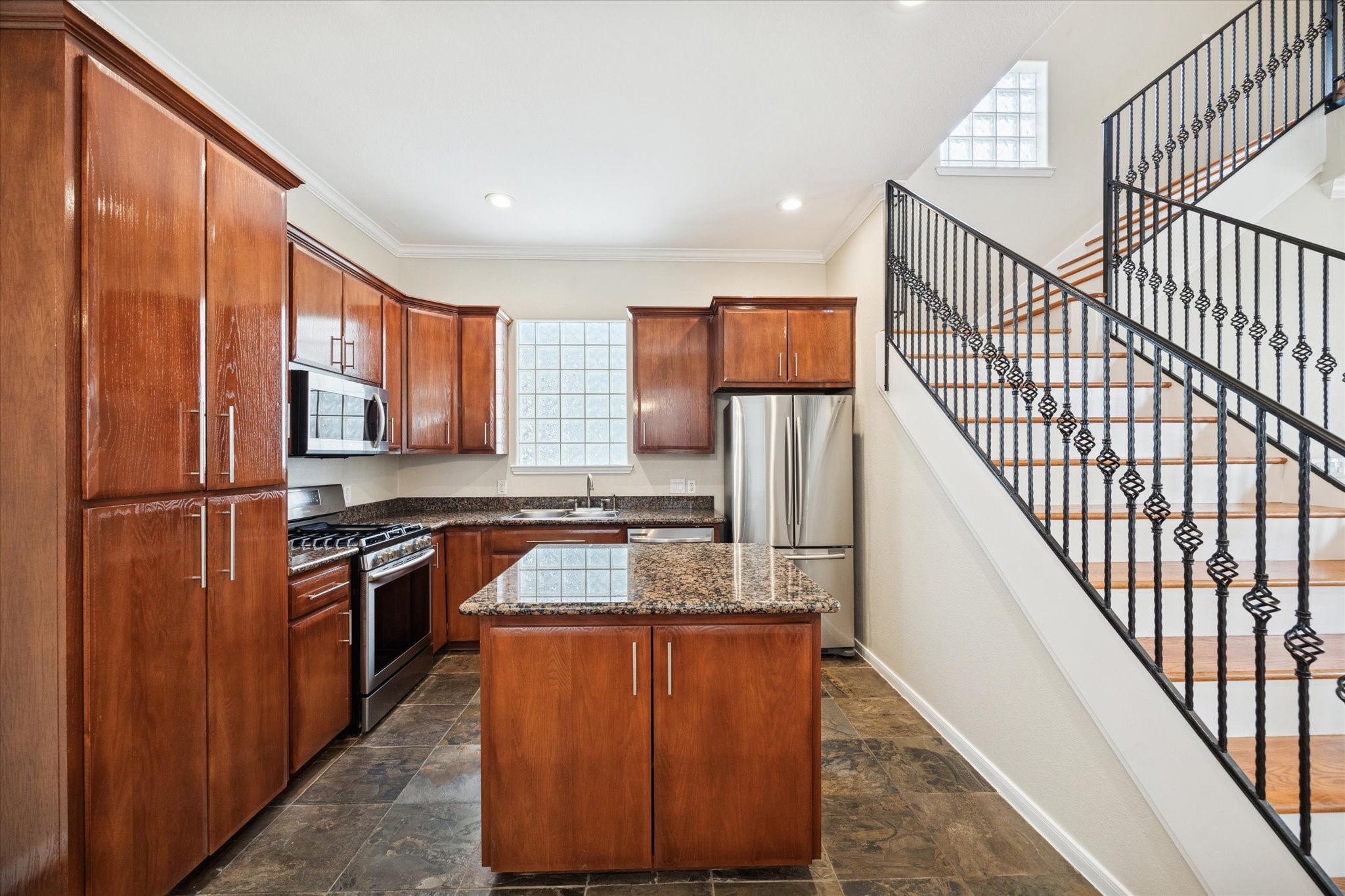1427 West 25th Street Houston, TX 77008 - Photo 13 of 36 a kitchen with stainless steel appliances granite countertop a refrigerator a stove a sink and dishwasher