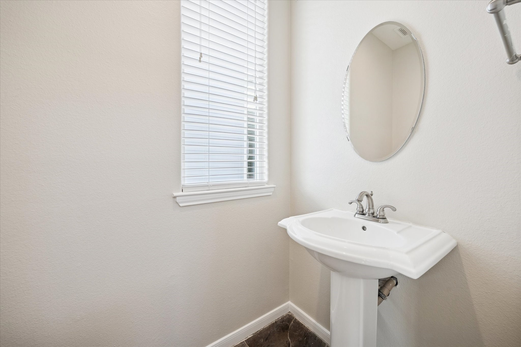 1427 West 25th Street Houston, TX 77008 - Photo 15 of 36 a bathroom with a sink and a mirror