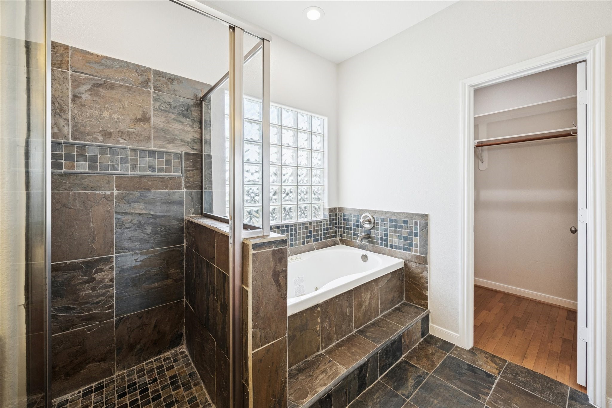 1427 West 25th Street Houston, TX 77008 - Photo 21 of 36 a bathroom with a double vanity sink a mirror and a shower