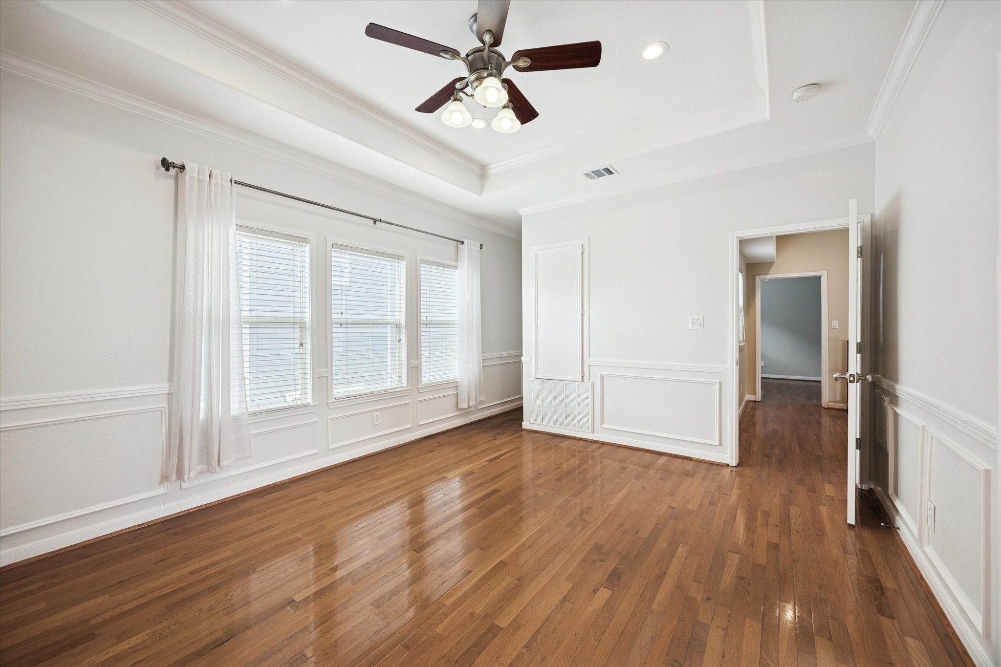 1427 West 25th Street Houston, TX 77008 - Photo 23 of 36 a view of empty room with wooden floor and fan