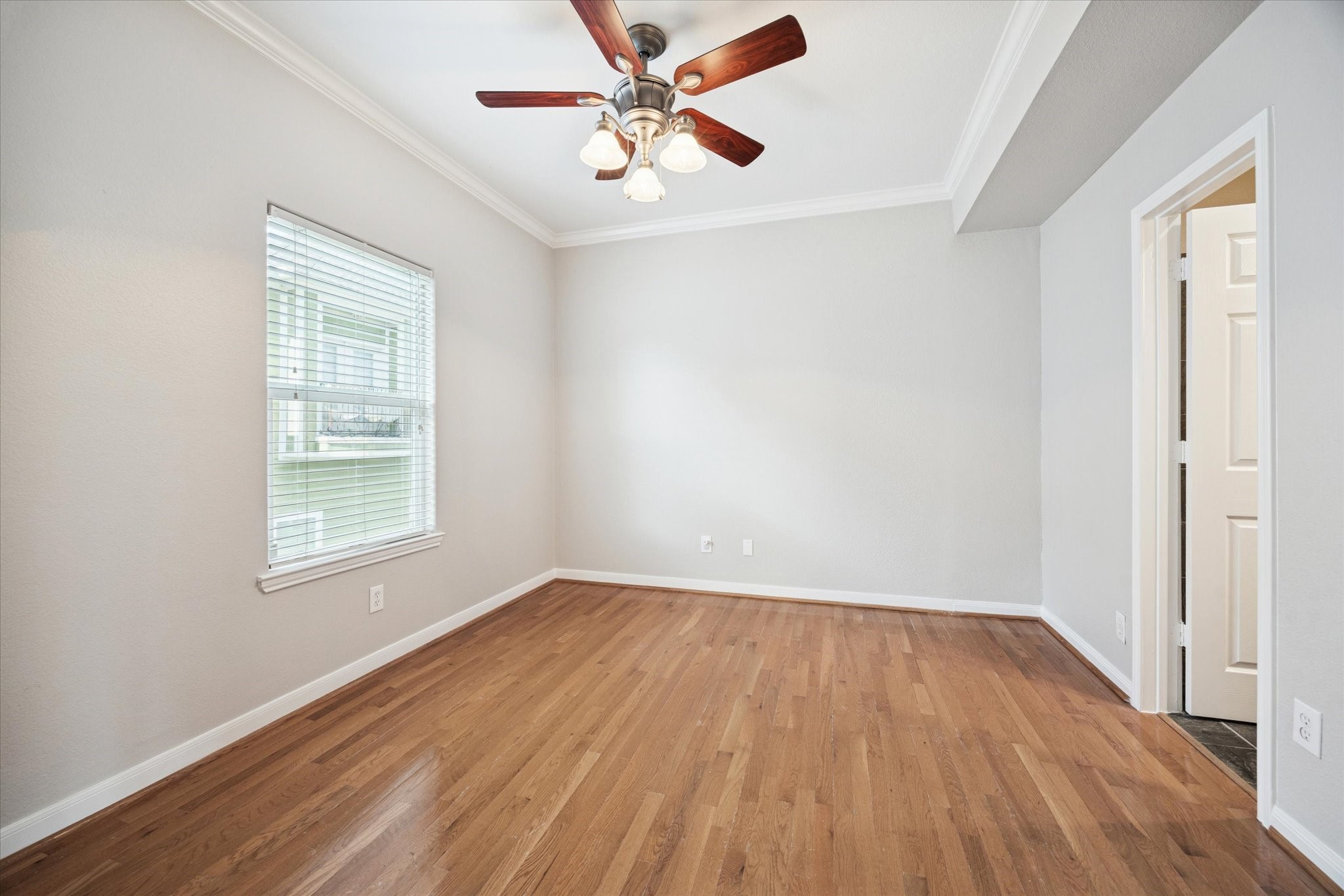 1427 West 25th Street Houston, TX 77008 - Photo 26 of 36 wooden floor in an empty room with a window
