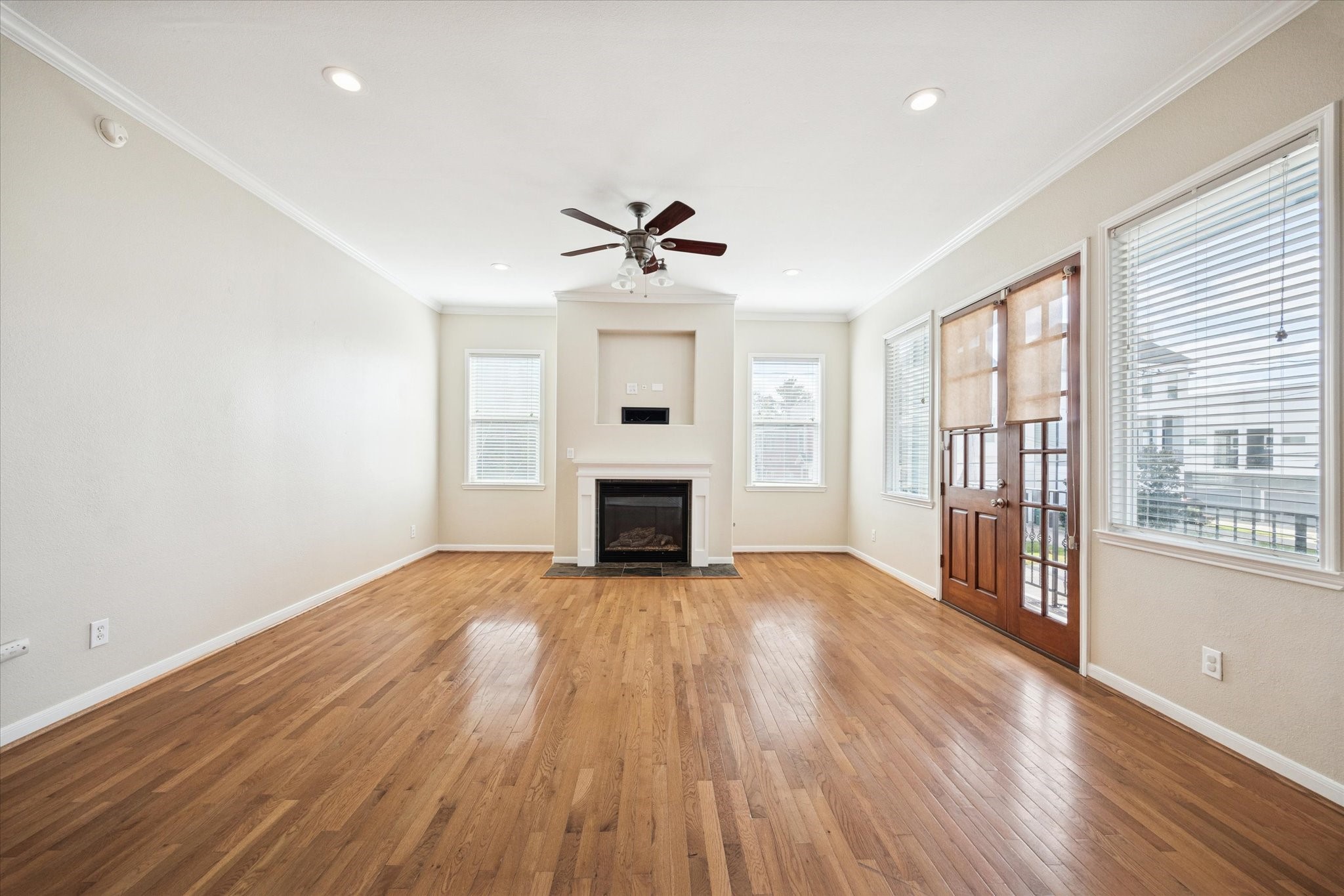 1427 West 25th Street Houston, TX 77008 - Photo 5 of 36 wooden floor in an empty room with a fireplace