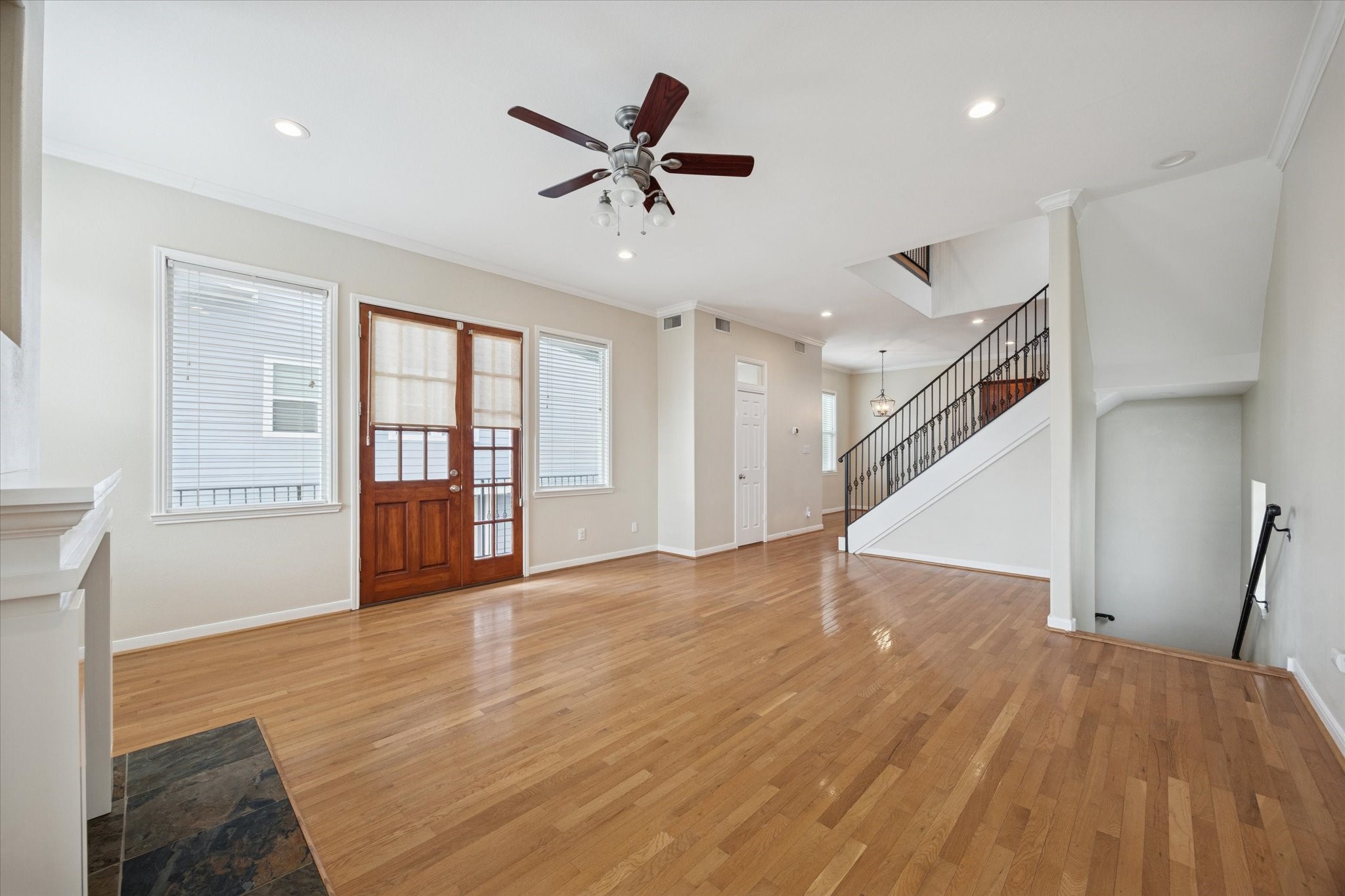1427 West 25th Street Houston, TX 77008 - Photo 7 of 36 a view of an empty room with wooden floor and a window