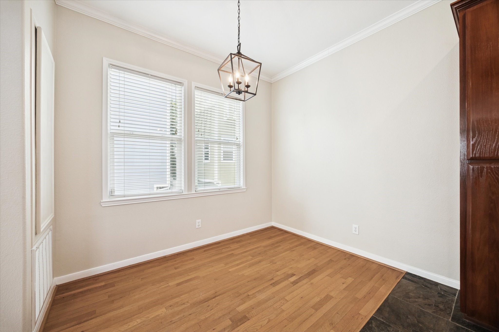 1427 West 25th Street Houston, TX 77008 - Photo 10 of 36 a view of a room with wooden floor and windows