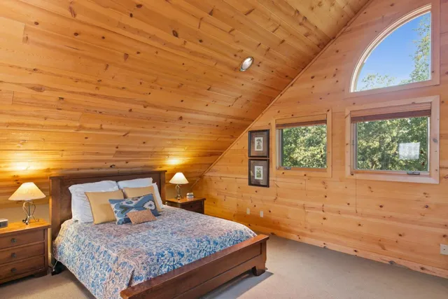 a utility room with stainless steel appliances granite countertop a stove and a microwave