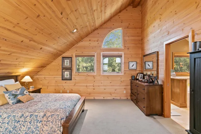a view of balcony with wooden floor and outdoor seating