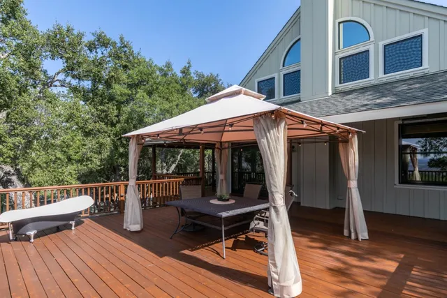 a view of a bedroom with furniture and window