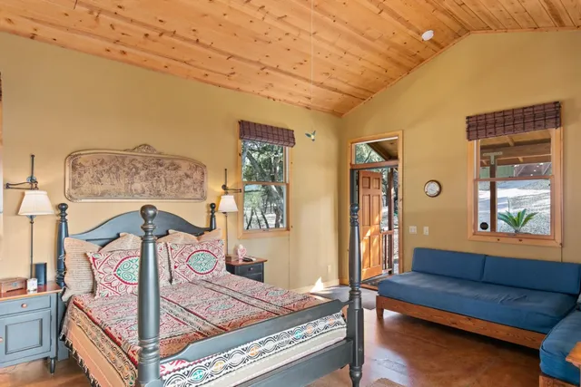 a bedroom with furniture and a window