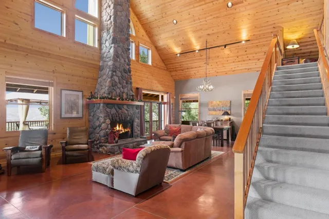 a view of a dining room with furniture large windows and wooden floor