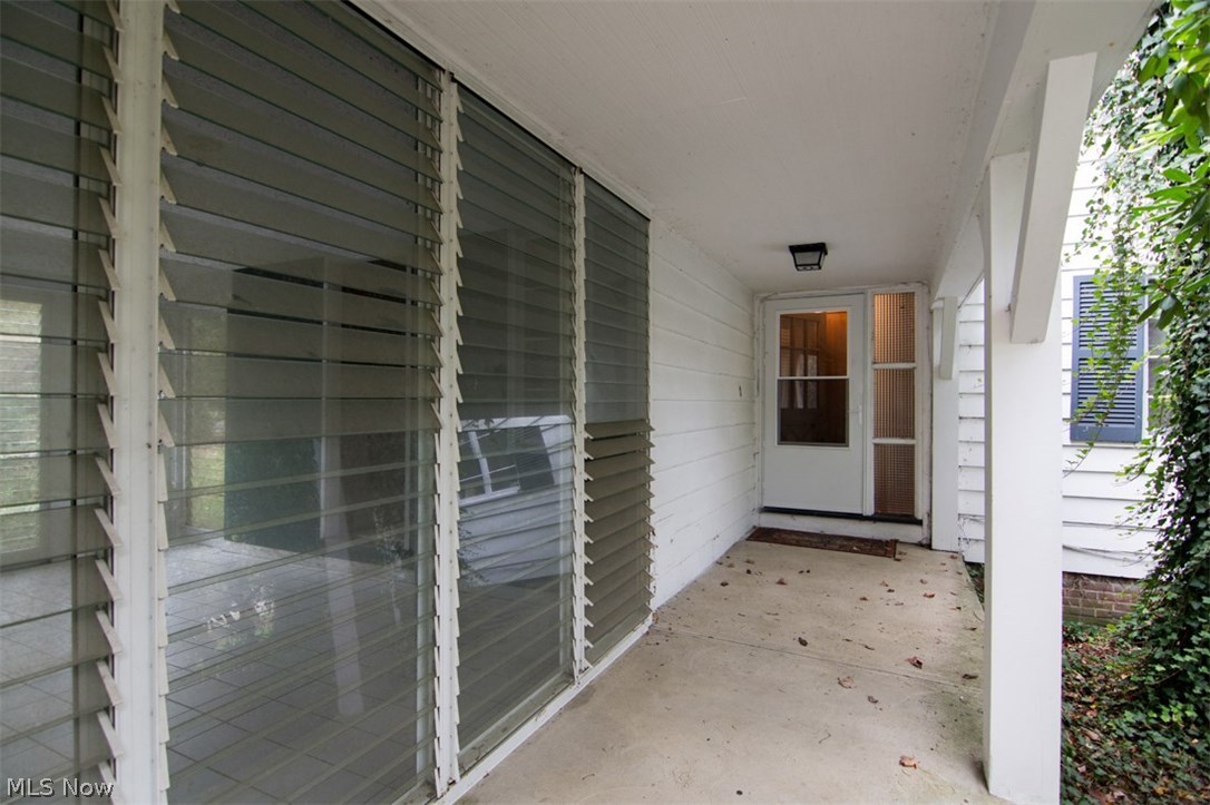 30200 Smithfield Road Chagrin Falls, OH 44022 - Photo 3 of 27 The charming front porch is perfect for welcoming guests or just enjoying a bit of fresh air.