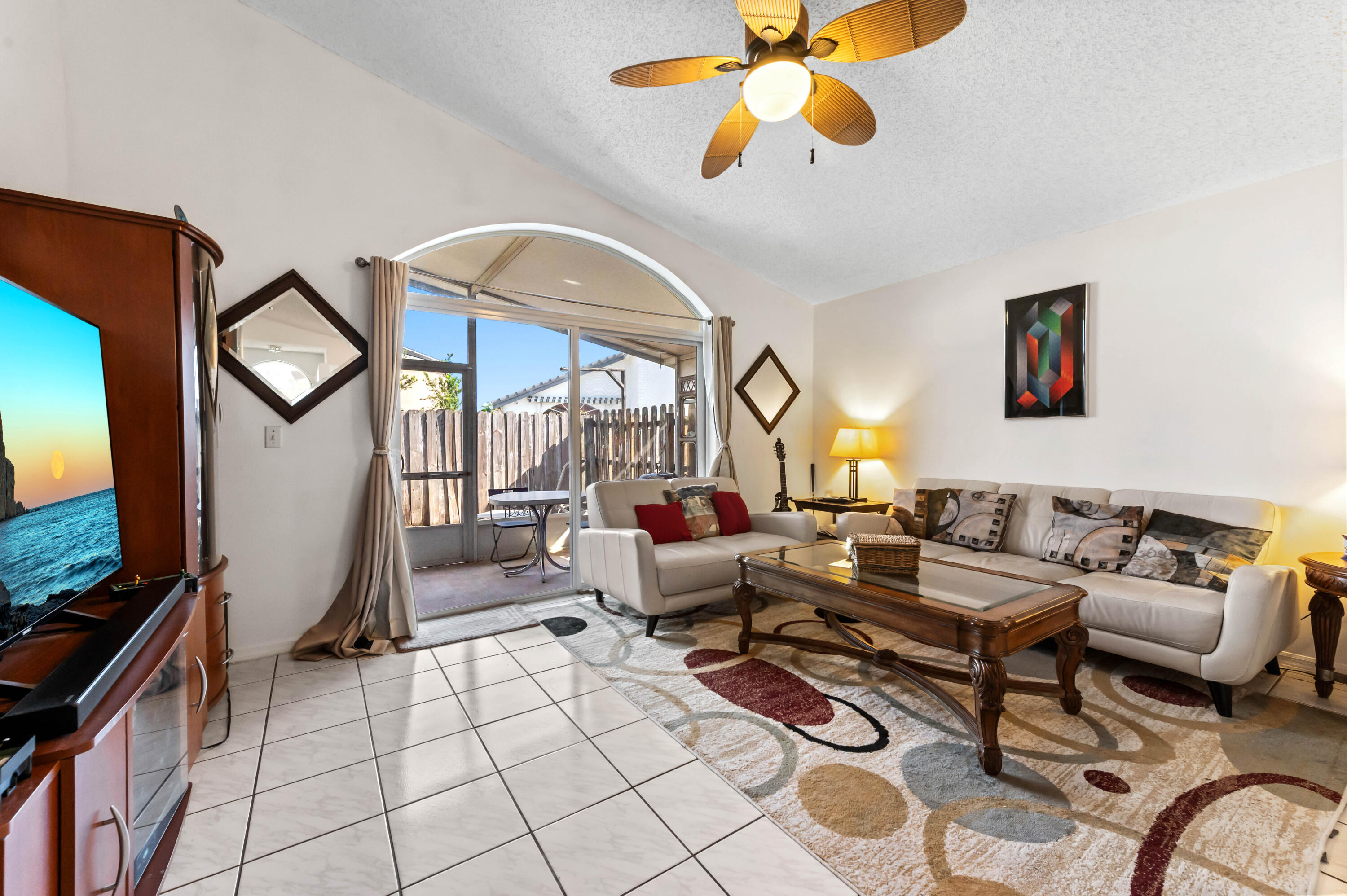 7409 Michigan Isle Road Lake Worth, FL 33467 - Photo 13 of 43 a living room with furniture chess floor and a flat screen tv