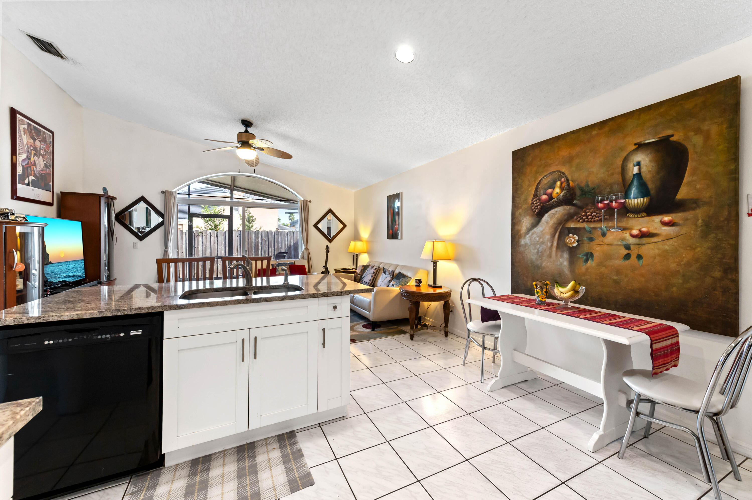 7409 Michigan Isle Road Lake Worth, FL 33467 - Photo 18 of 43 a kitchen with a sink and a stove top oven