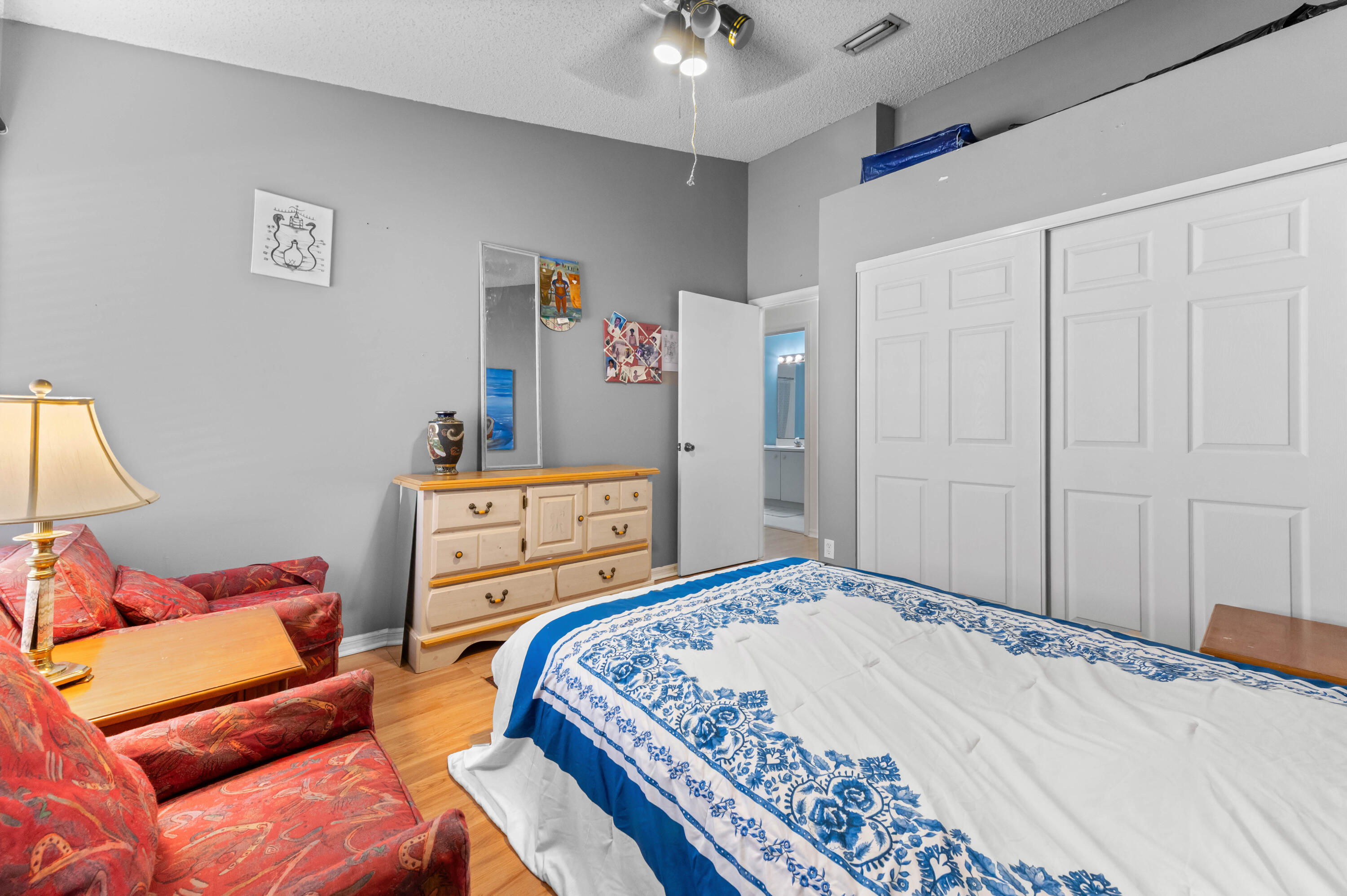 7409 Michigan Isle Road Lake Worth, FL 33467 - Photo 22 of 43 a bedroom with a bed and a couch