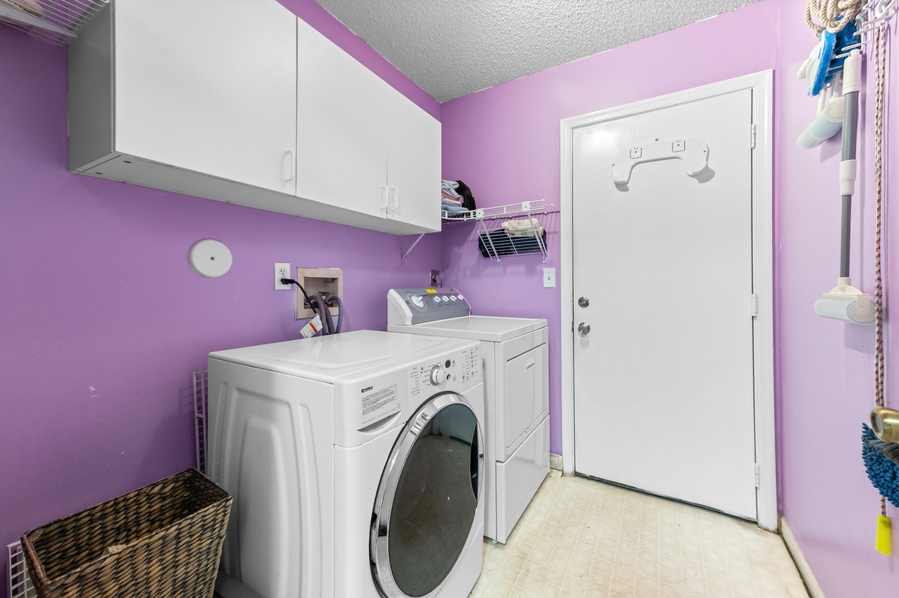 7409 Michigan Isle Road Lake Worth, FL 33467 - Photo 32 of 43 a utility room with a washer and dryer