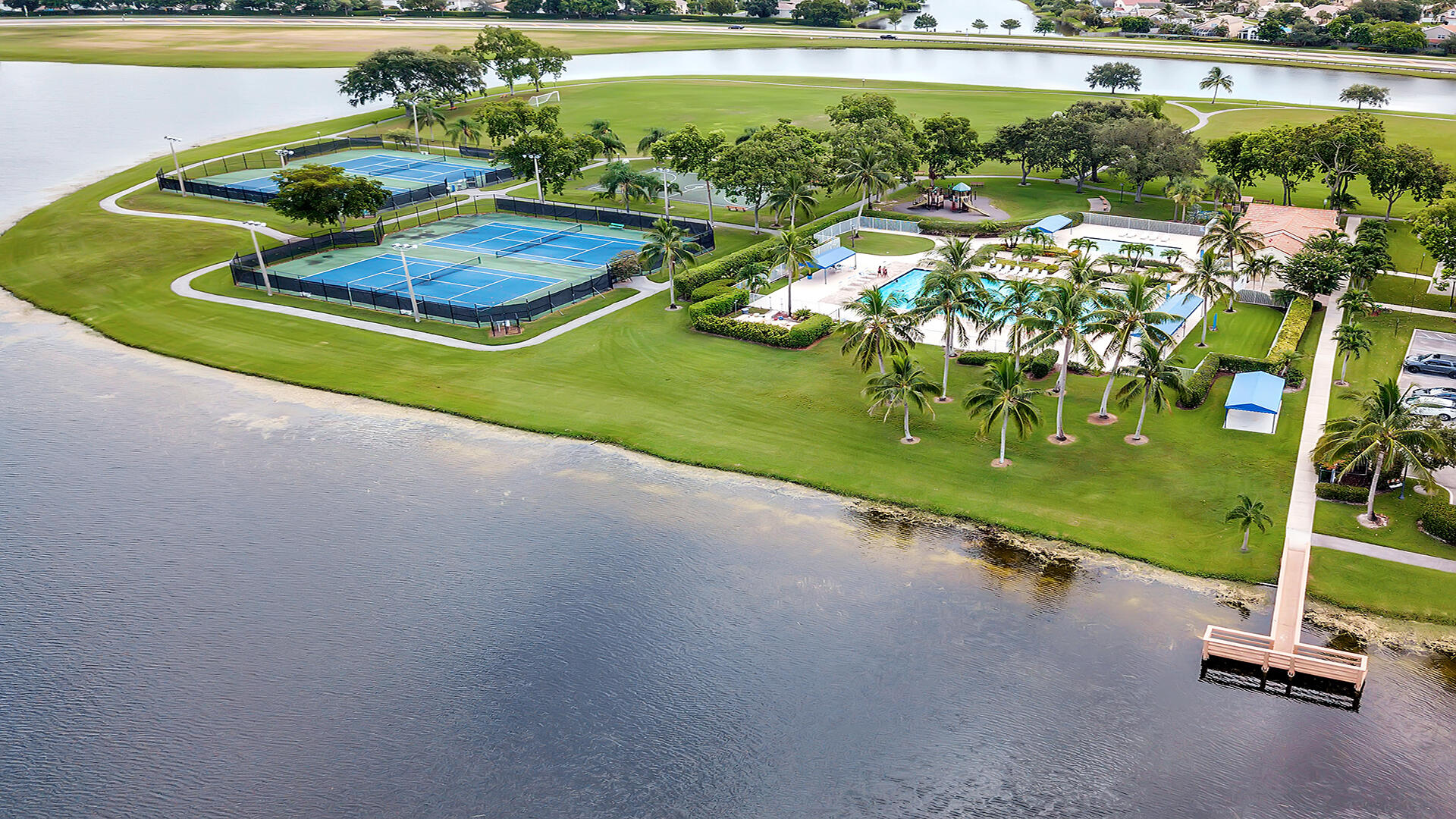 7409 Michigan Isle Road Lake Worth, FL 33467 - Photo 41 of 43 a view of a swimming pool and outdoor space
