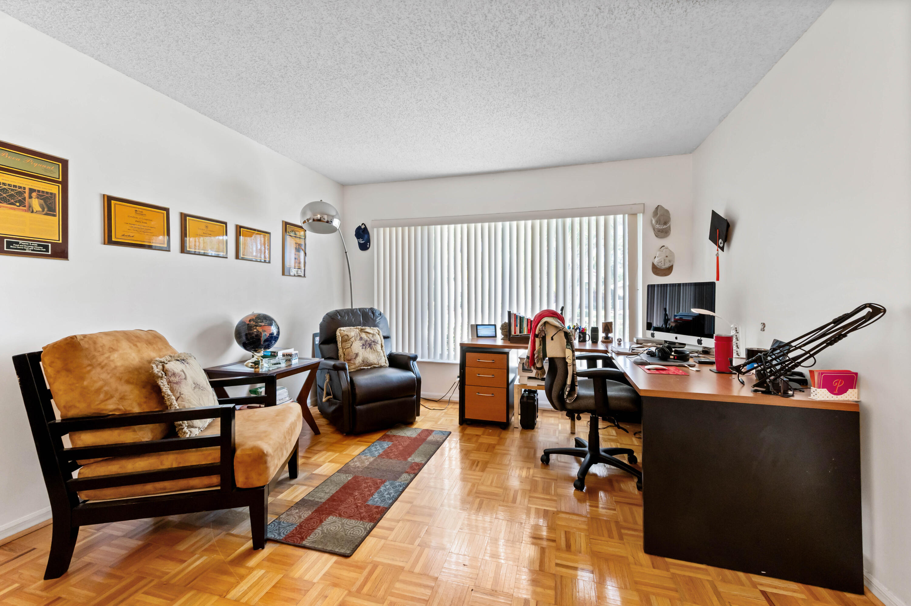7409 Michigan Isle Road Lake Worth, FL 33467 - Photo 10 of 43 a living room with furniture and a flat screen tv