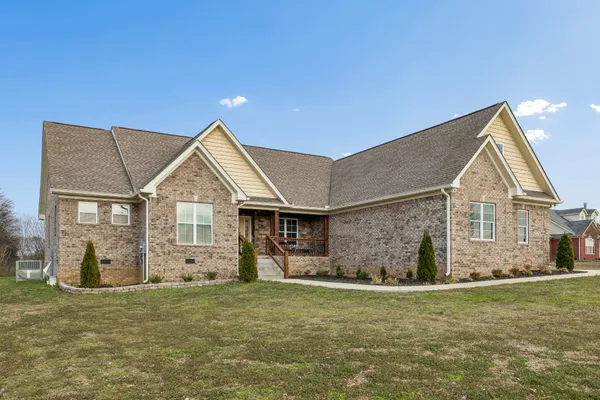a front view of a house with a yard