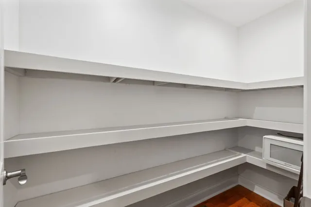 a view of an empty walk in closet