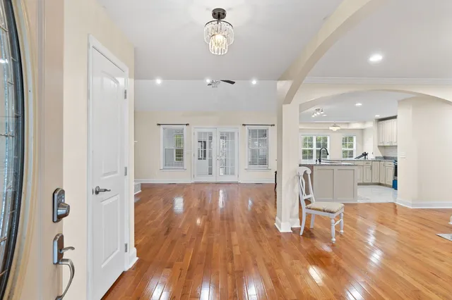a view of a kitchen and dinning room with wooden floor