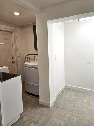 a view of a room with utility room and washer dryer
