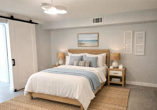 a bedroom with bed and a window