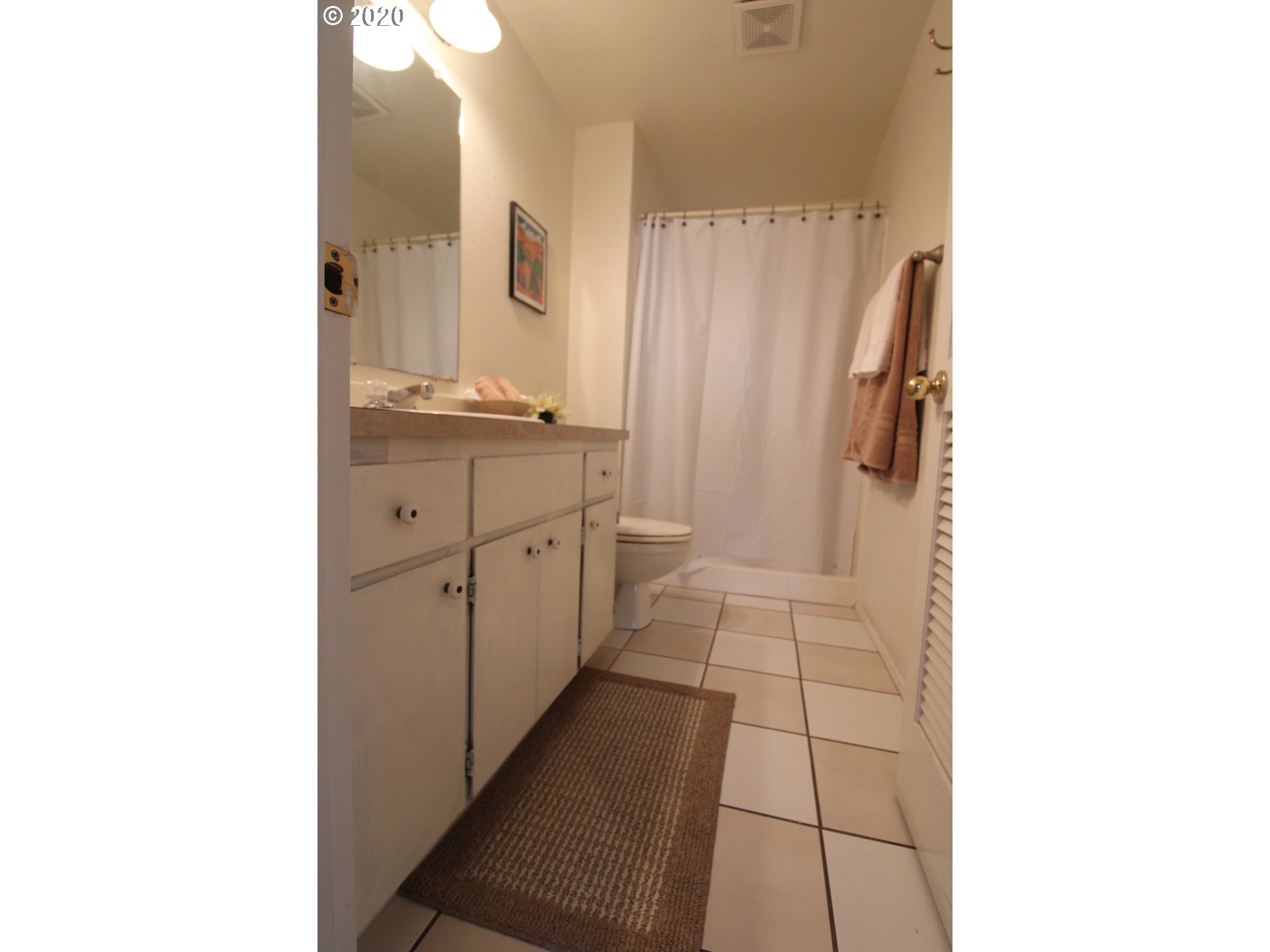 500 North 49th Street Springfield, OR 97478 - Photo 12 of 16 a bathroom with a double vanity sink toilet and shower