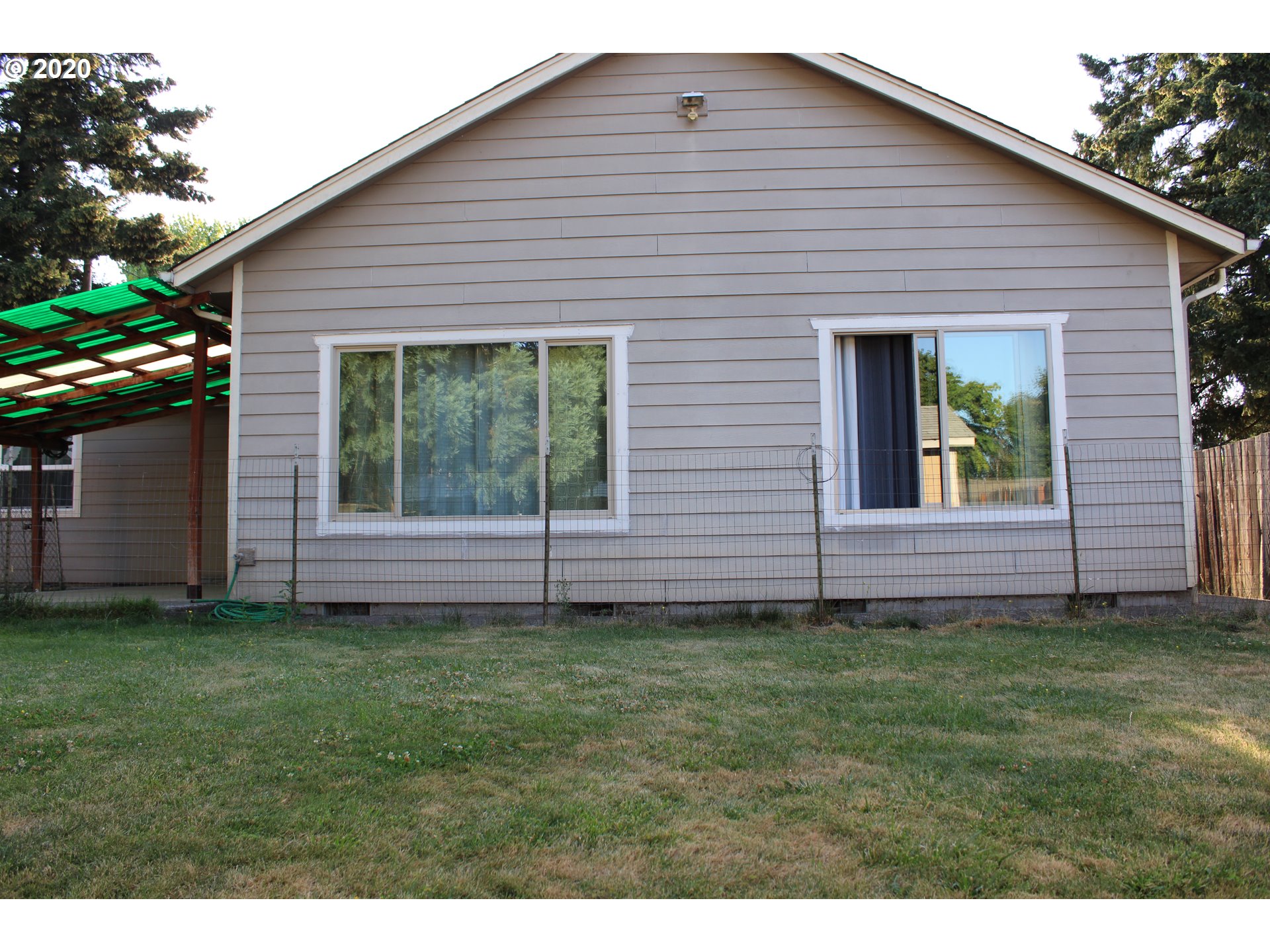 500 North 49th Street Springfield, OR 97478 - Photo 15 of 16 a front view of a house with a garden