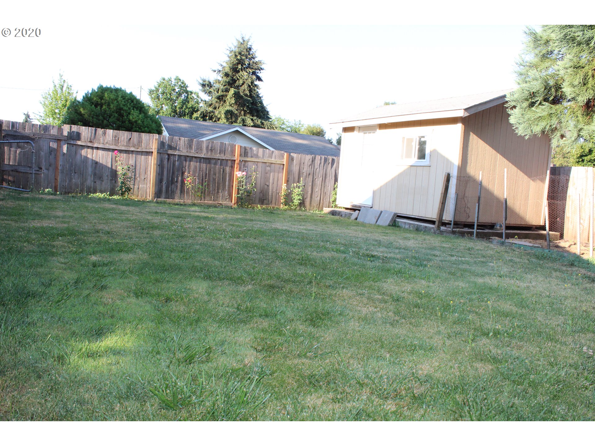 500 North 49th Street Springfield, OR 97478 - Photo 16 of 16 a view of a backyard with a garden and deck