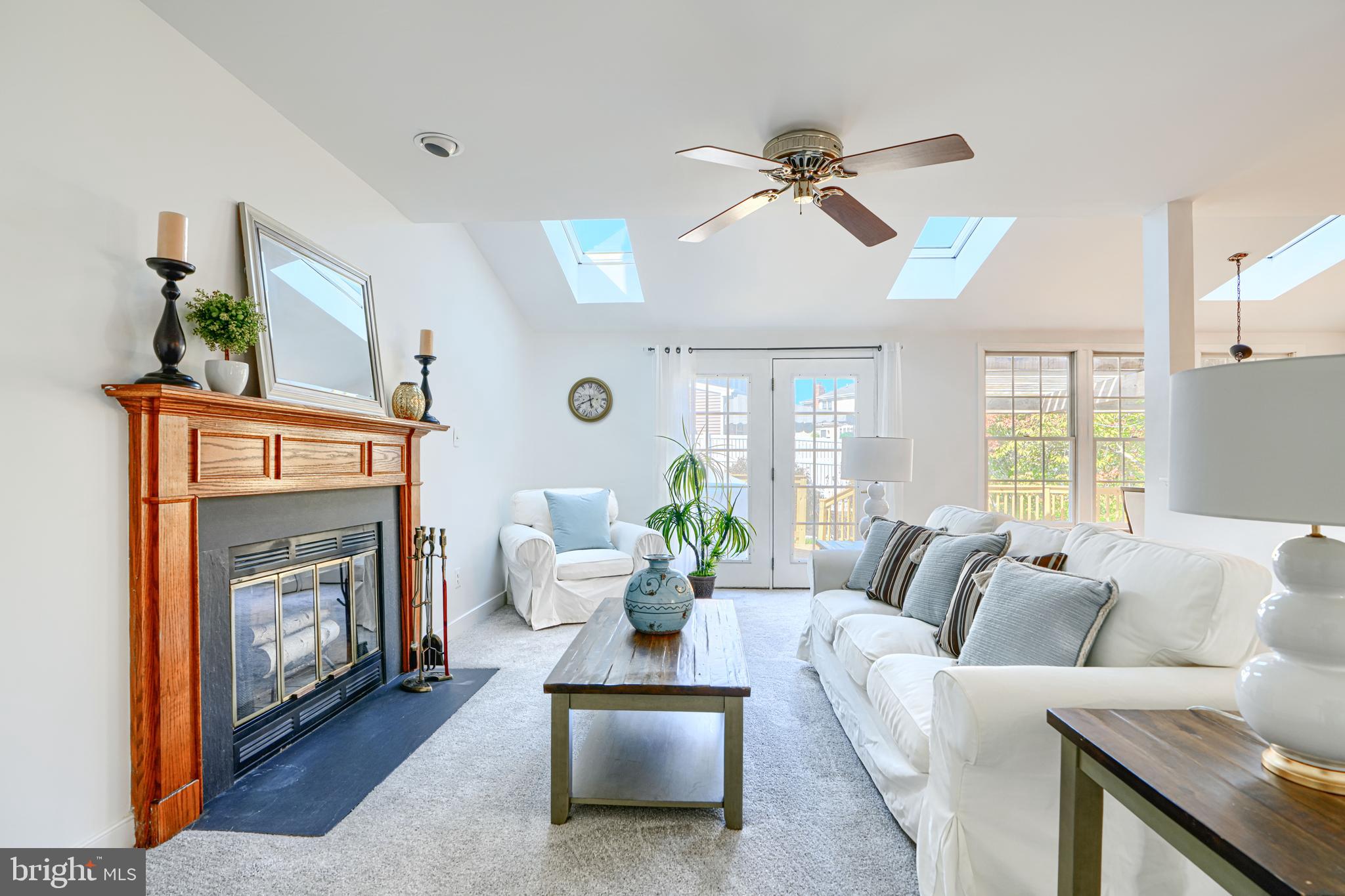 9018 Gardenia Road Baltimore, MD 21236 - Photo 12 of 47 a living room with furniture and a fireplace