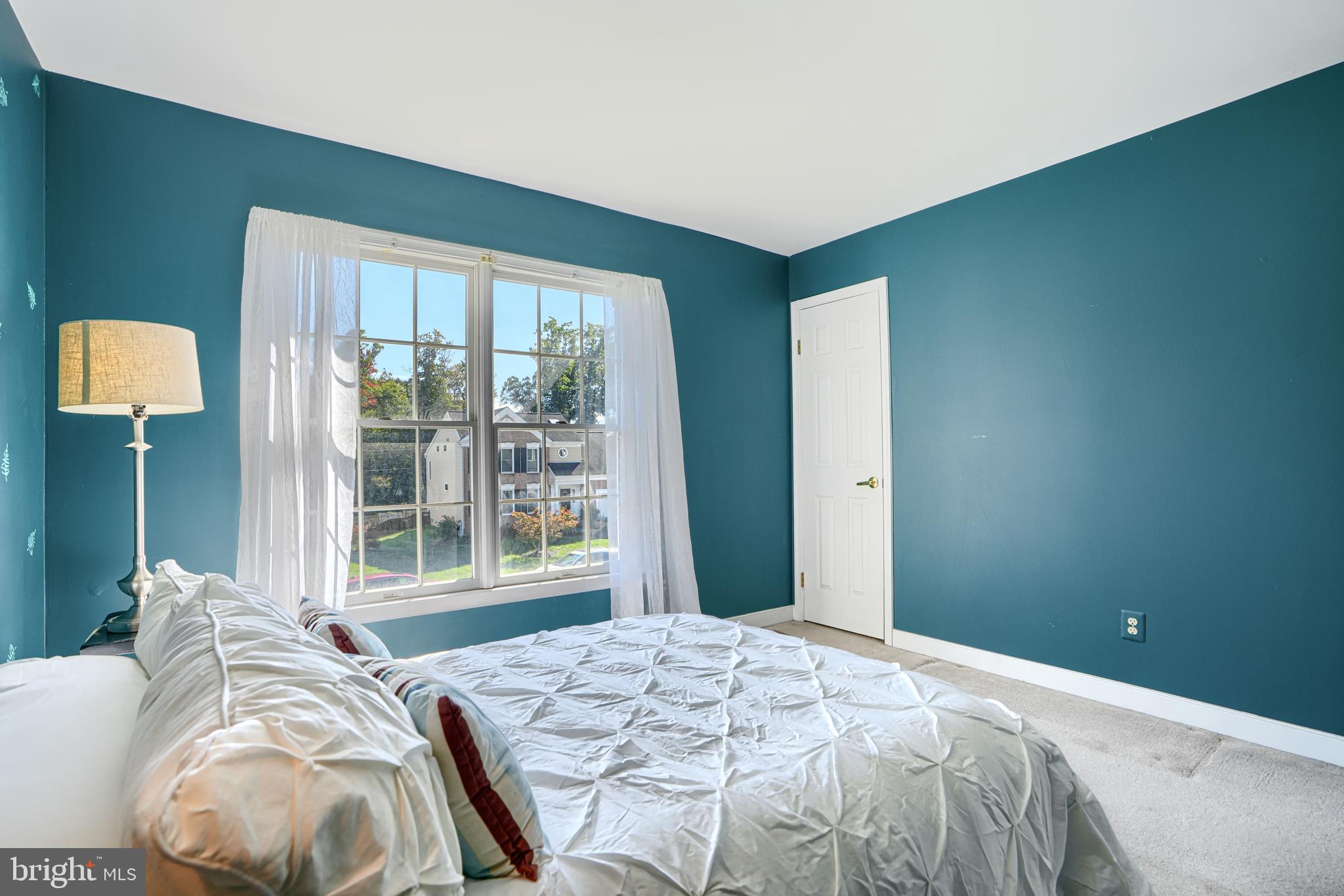 9018 Gardenia Road Baltimore, MD 21236 - Photo 30 of 47 a bed sitting in a bedroom next to a window