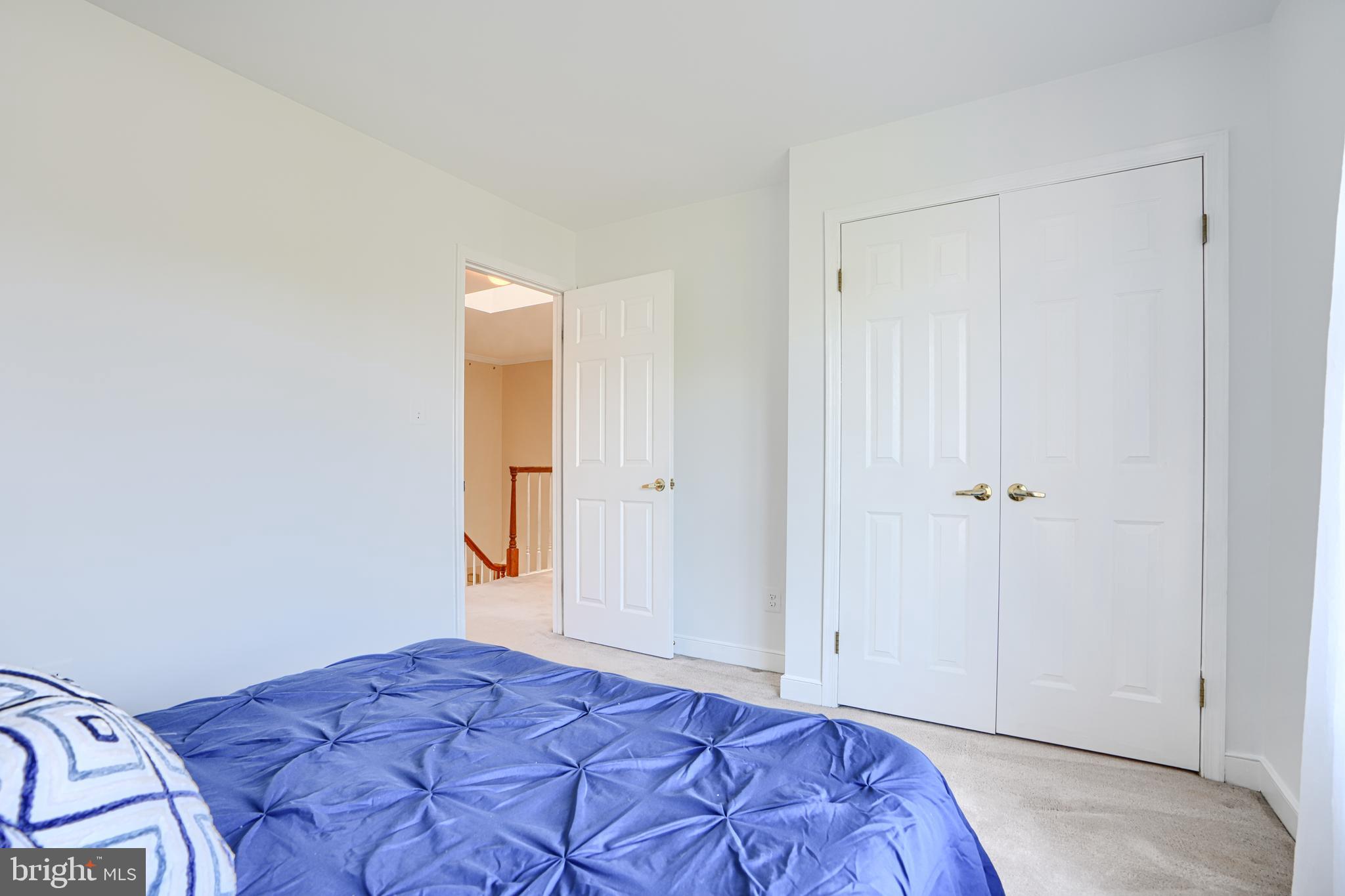 9018 Gardenia Road Baltimore, MD 21236 - Photo 32 of 47 a bedroom with a bed and a mirror