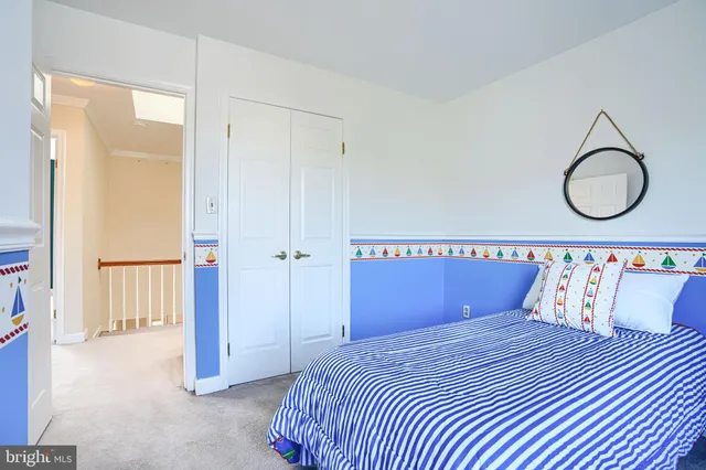 a bedroom with bed and a window