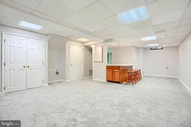 a large room with a table and chairs