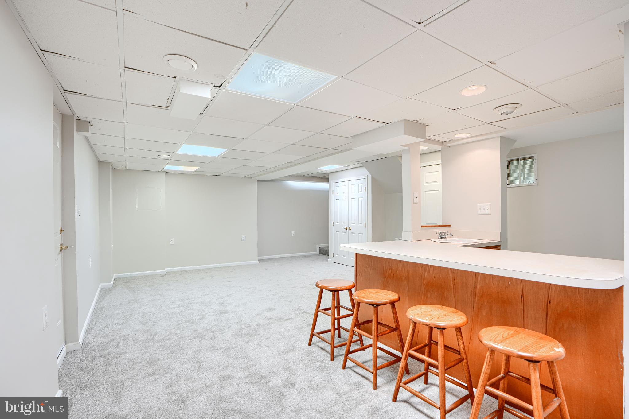 9018 Gardenia Road Baltimore, MD 21236 - Photo 37 of 47 a large room with a table and chairs