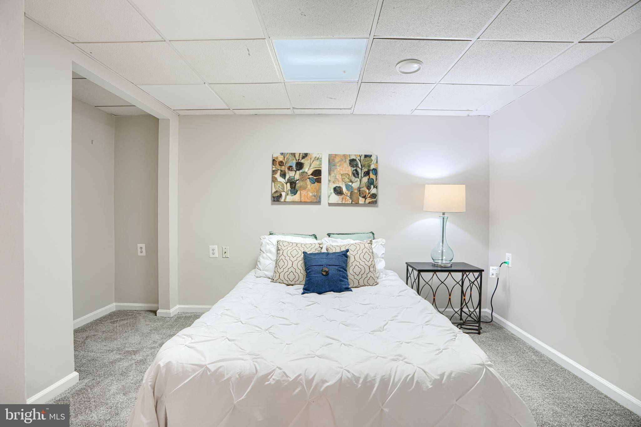 9018 Gardenia Road Baltimore, MD 21236 - Photo 39 of 47 a bedroom with a bed and painting on the wall