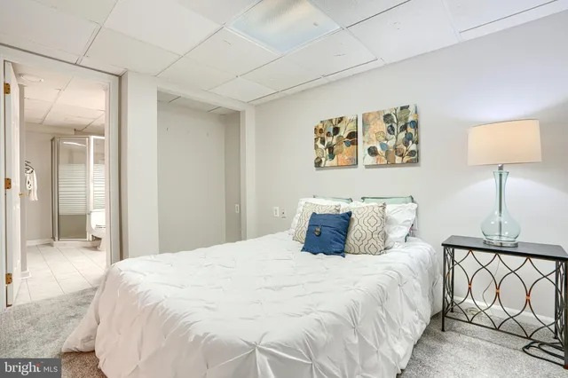 a white toilet sitting next to a bathroom sink