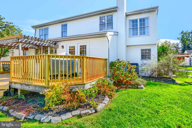 a view of a chair and table in the garden