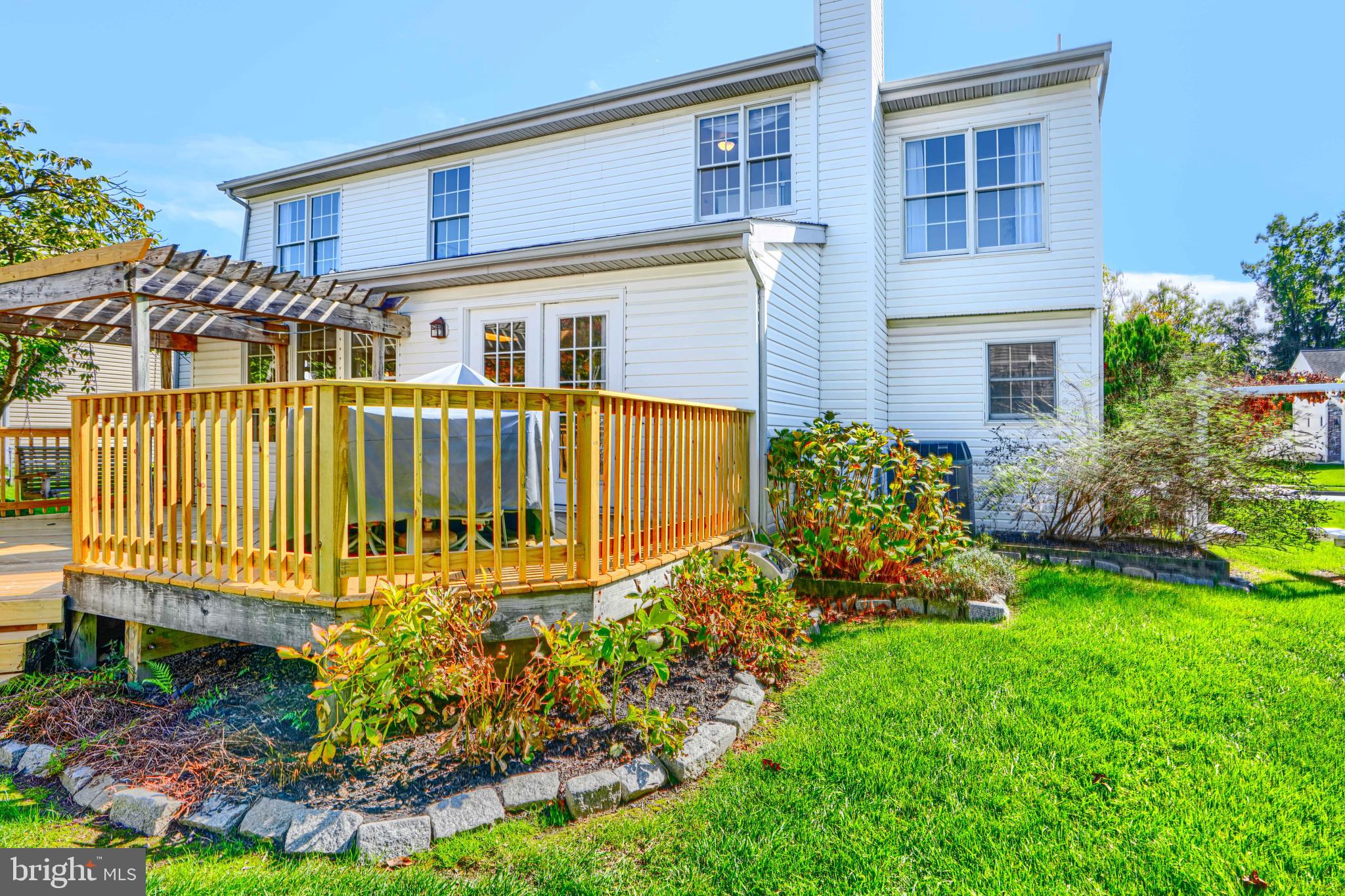 9018 Gardenia Road Baltimore, MD 21236 - Photo 42 of 47 a front view of a house with garden