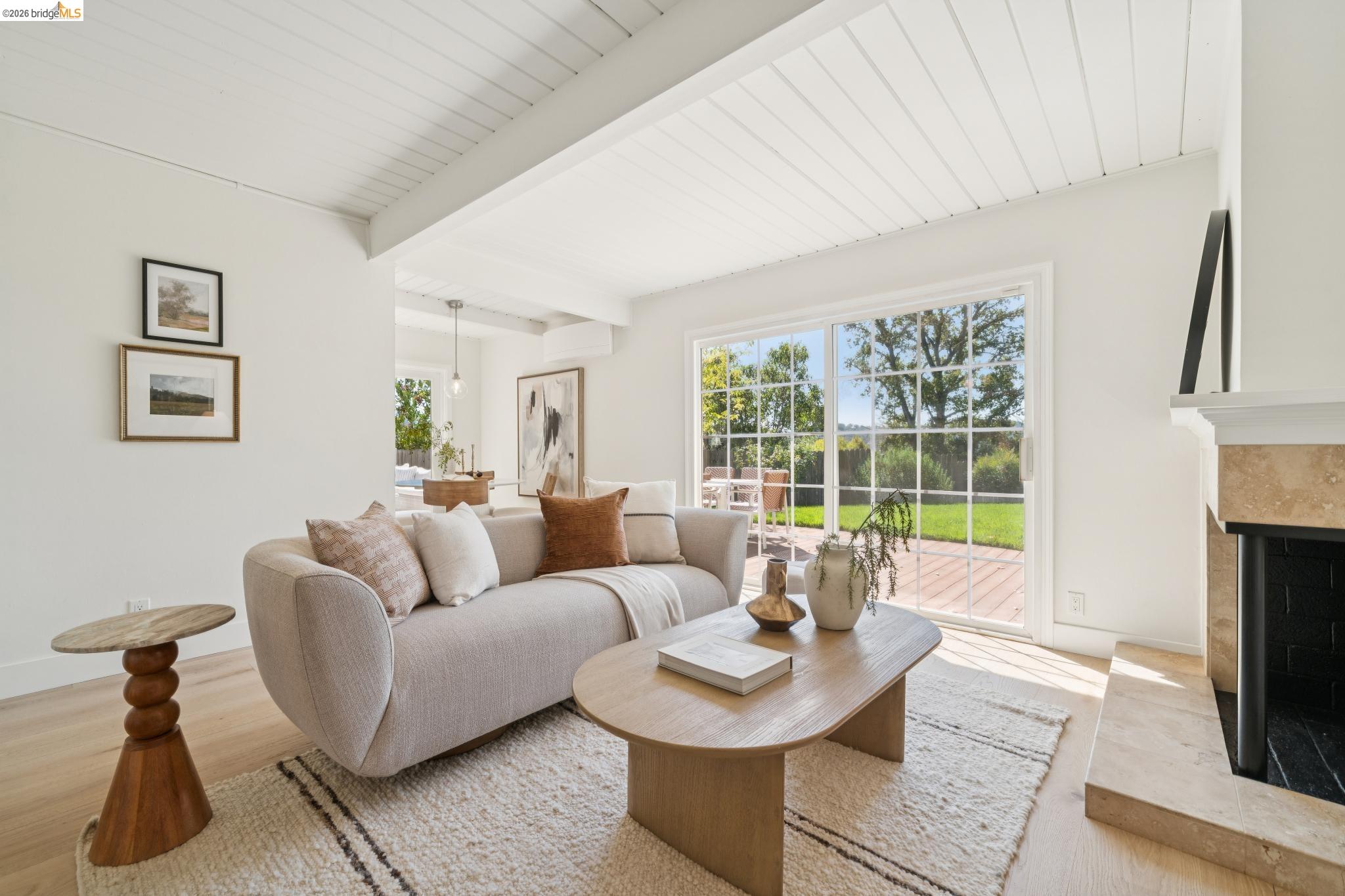 1321 Sunset Loop Lafayette, CA 94549 - Photo 6 of 49 White wood-paneled ceiling, wood-finish flooring, sliding glass door, fireplace with stone surround, and wood deck