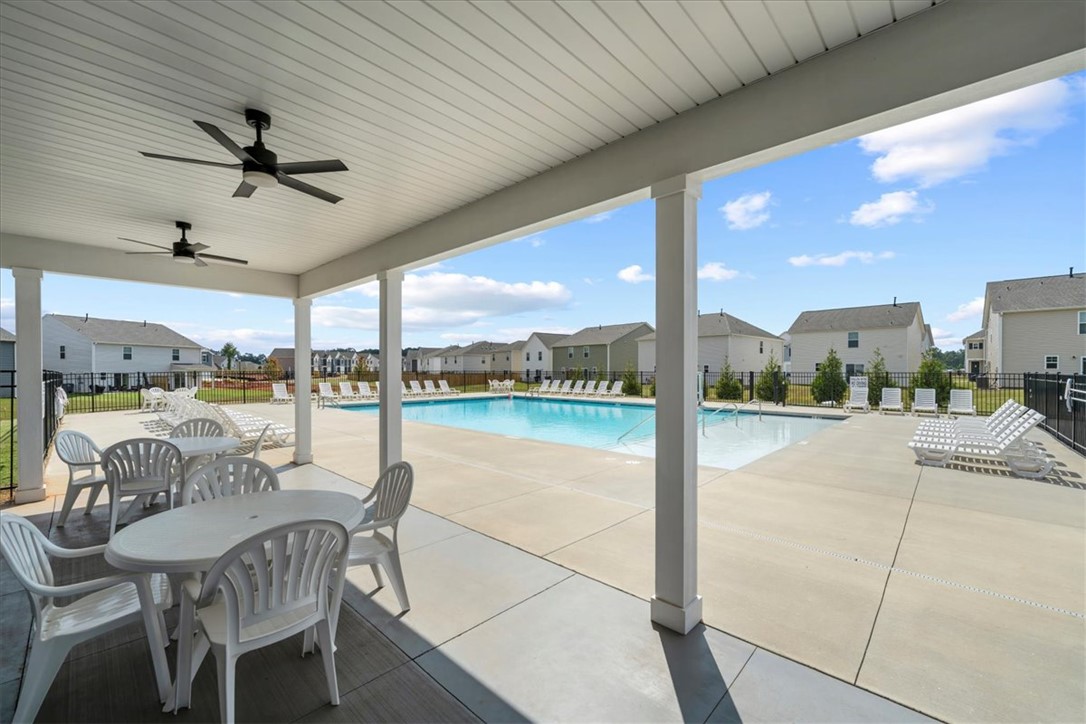 117 Adger Road Pendleton, SC 29670 - Photo 32 of 36 Enjoy leisurely afternoons by the expansive community pool, complete with comfortable lounge seating.