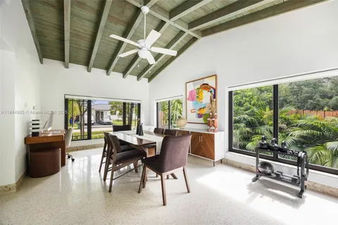 a dining room with furniture water view and a fireplace