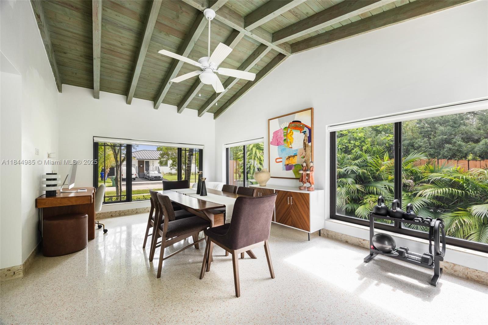 1080 Northeast 86th Street Miami, FL 33138 - Photo 17 of 25 a dining room with furniture water view and a fireplace