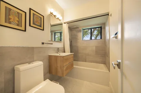 a bathroom with a toilet and a bathtub