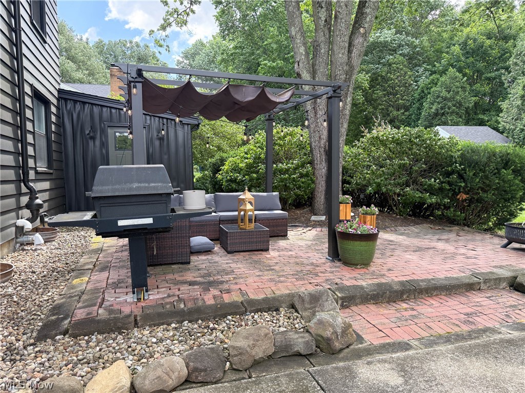 2411 Ridgeview Lane Youngstown, OH 44514 - Photo 43 of 48 Brick paver patio featuring a retractable canopy pergola