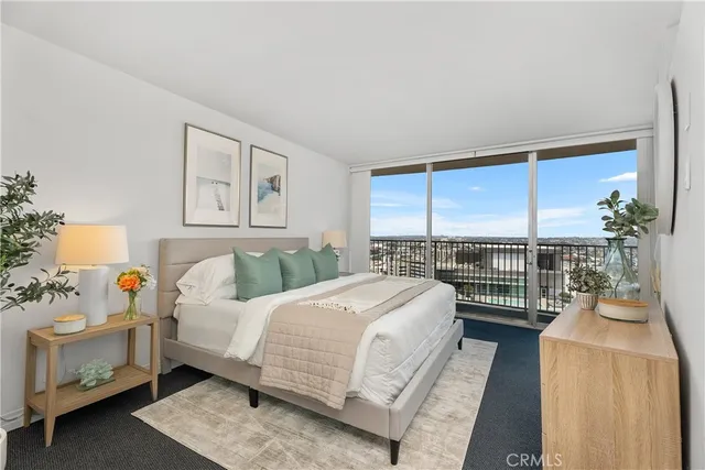 a bedroom with a bed and a night stand